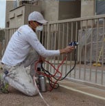 Commercial painting services on a metal fence