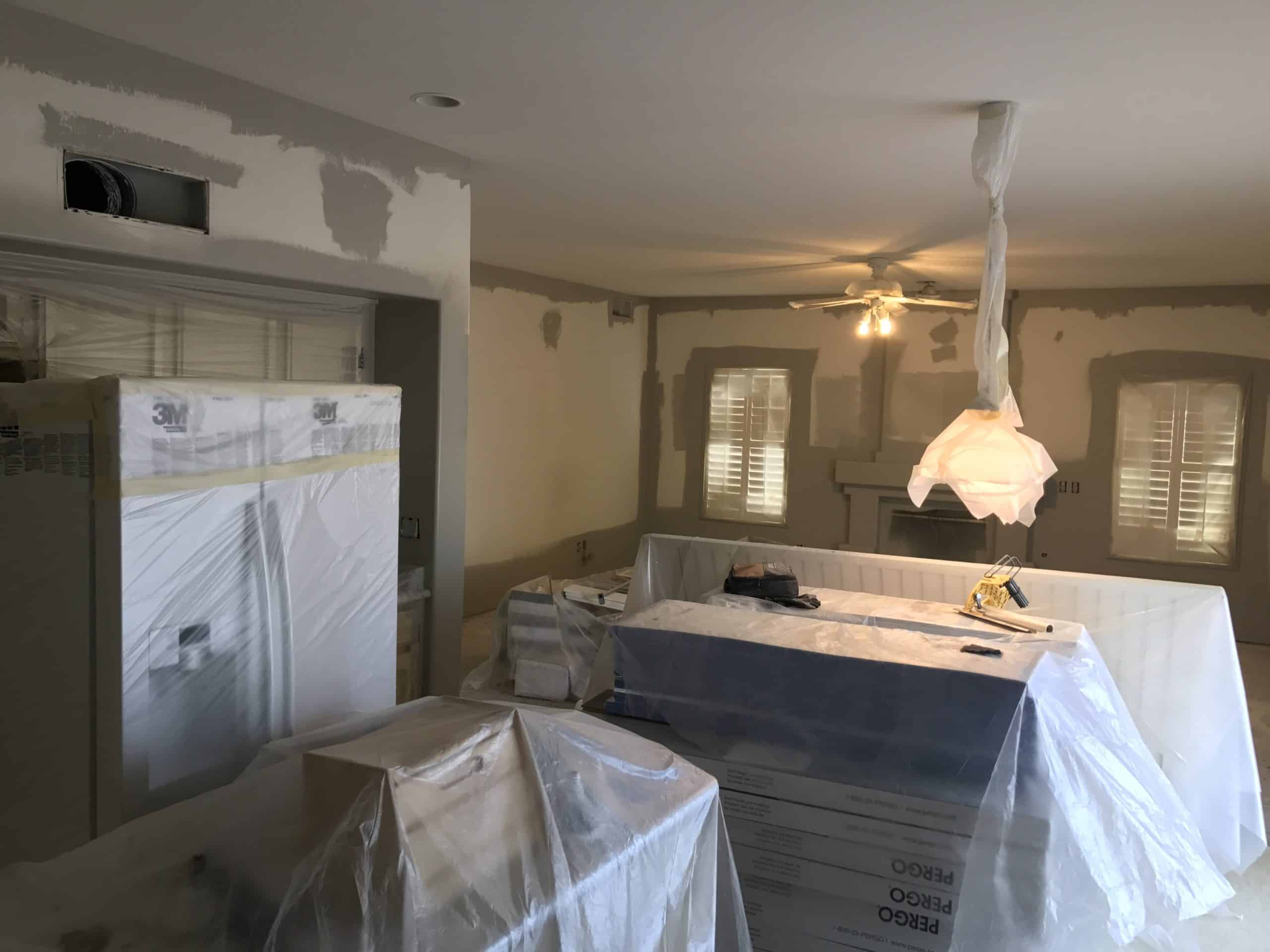 Home appliances and fixtures protected during paint job renovation